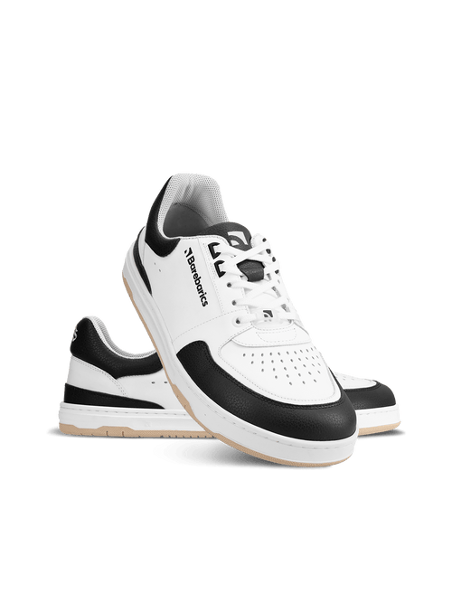 Barebarics Wave – White & Black Les Barebarics Wave White & Black associent un design intemporel à tous les avantages d'une véritable chaussure barefoot. Fabriquées en cuir Nappa premium, elles offrent un confort exceptionnel, une grande liberté de mouve - Pas Naturels