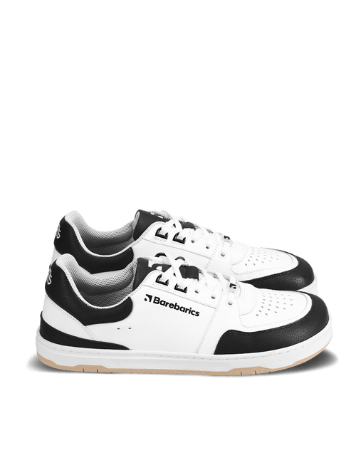 Barebarics Wave – White & Black Les Barebarics Wave White & Black associent un design intemporel à tous les avantages d'une véritable chaussure barefoot. Fabriquées en cuir Nappa premium, elles offrent un confort exceptionnel, une grande liberté de mouve - Pas Naturels